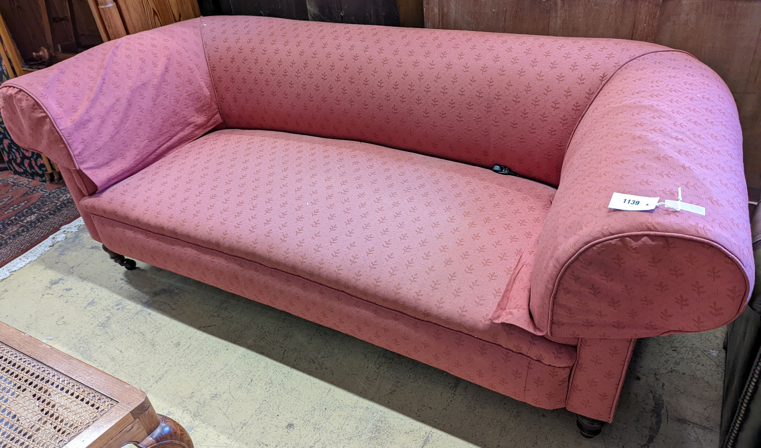 A Victorian red upholstered chesterfield settee, length 202cm, depth 92cm, height 72cm